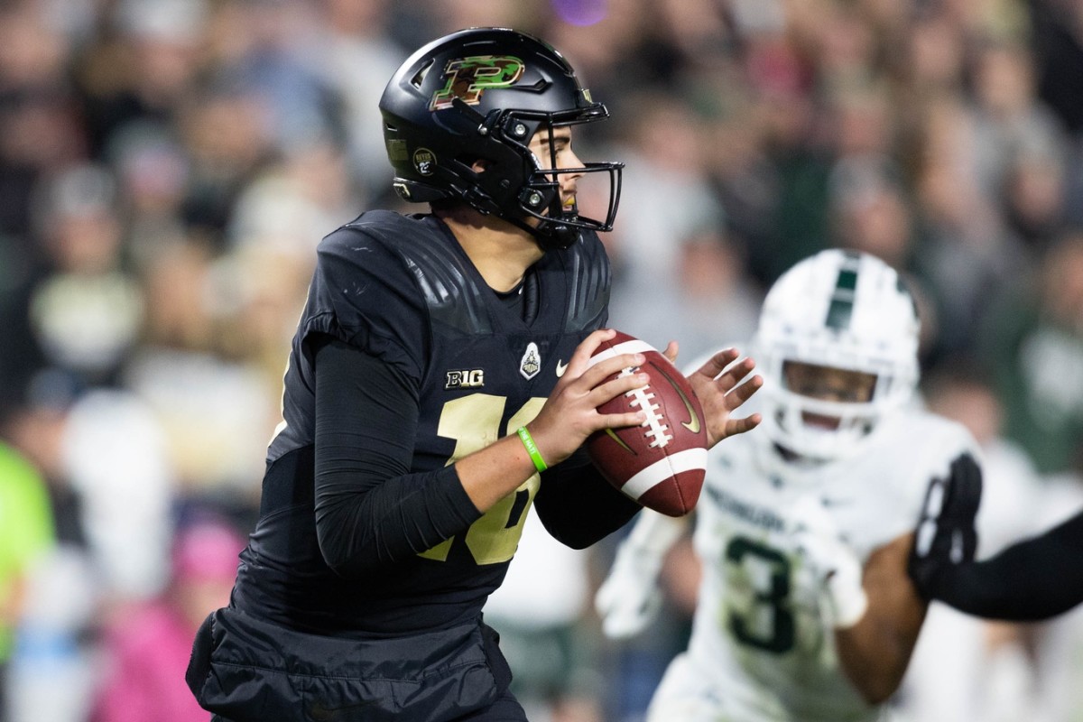 Nov 6, 2021; West Lafayette, Indiana, USA; Purdue Boilermakers quarterback Aidan O'Connell (16) drops back to pass the ball in the second half against the Michigan State Spartans at Ross-Ade Stadium.